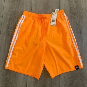 Adidas men 3Ssize S men swim shorts. Color orange/ rush white